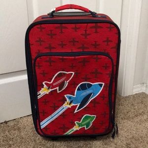 Boys rolling suitcase